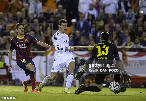 Real Madrid's Welsh forward Gareth Bale scores during the Spanish Copa del Rey final "Clasico" football match FC Barcelona vs Real Madrid CF at the...