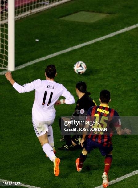 Real Madrid's Welsh forward Gareth Bale scores during the Spanish Copa del Rey final "Clasico" football match FC Barcelona vs Real Madrid CF at the...