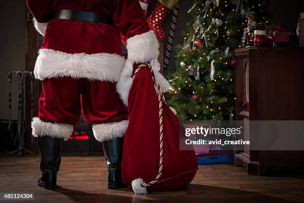 real santa with bag of gifts - part of house stock pictures, royalty-free photos & images