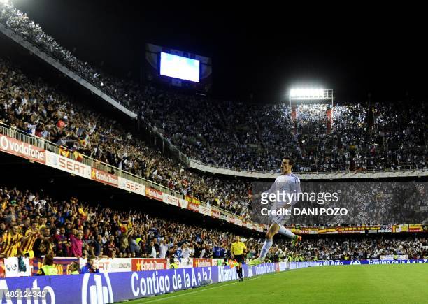 Real Madrid's Welsh forward Gareth Bale celebrates after scoring during the Spanish Copa del Rey final "Clasico" football match FC Barcelona vs Real...