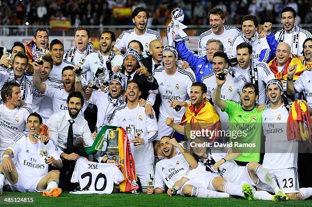 Real Madrid CF players celebrate with the trophy after winning the Copa del Rey Final between Real Madrid and FC Barcelona at Estadio Mestalla on...