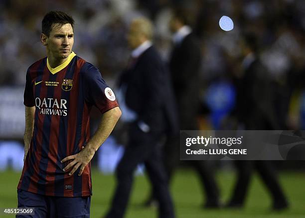 Barcelona's Argentinian forward Lionel Messi reacts at the end of the Spanish Copa del Rey final "Clasico" football match FC Barcelona vs Real Madrid...