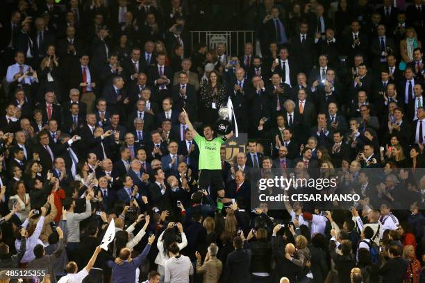 Real Madrid's goalkeeper Iker Casillas celebrates with the trophy after winning the Spanish Copa del Rey final "Clasico" football match FC Barcelona...