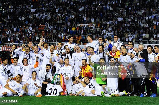 Real Madrid CF players celebrate with the trophy after winning the Copa del Rey Final between Real Madrid and FC Barcelona at Estadio Mestalla on...