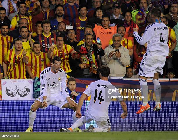 Gareth Bale of Real Madrid celebrates with Xabi Alonso and Sergio Ramos after scoring Real's 2nd goal during the Copa del Rey Final between Real...