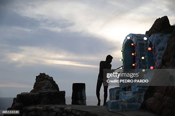 Cliff diver prepares to jump at La Quebrada in Acapulco, Mexico on August 14, 2015. The tradition of 'La Quebrada' goes back to 1934, when two...