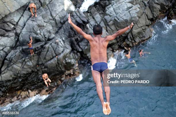 Cliff diver jumps at La Quebrada in Acapulco, Mexico on August 14, 2015. The tradition of 'La Quebrada' goes back to 1934, when two neighbors of...