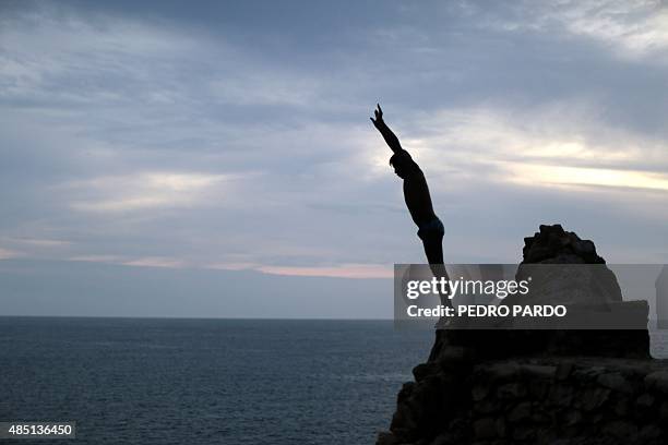 Cliff diver prepares to jump at La Quebrada in Acapulco, Mexico on August 14, 2015. The tradition of 'La Quebrada' goes back to 1934, when two...