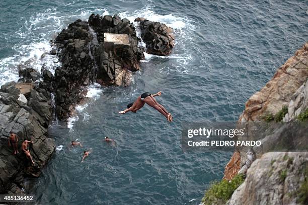 Cliff diver jumps at La Quebrada in Acapulco, Mexico on August 14, 2015. The tradition of 'La Quebrada' goes back to 1934, when two neighbors of...