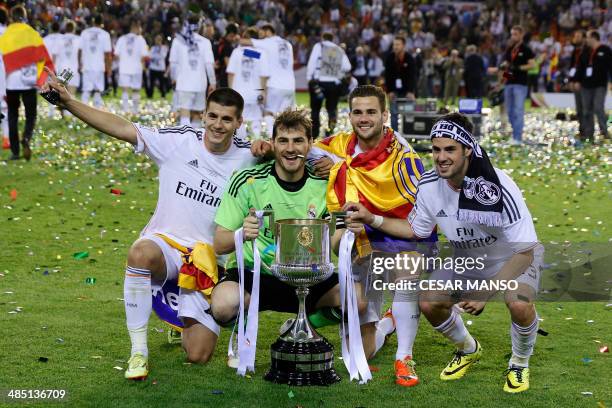 Real Madrid's forward Alvaro Morata, Real Madrid's goalkeeper Iker Casillas, Real Madrid's midfielder Nacho and Real Madrid's midfielder Isco pose...