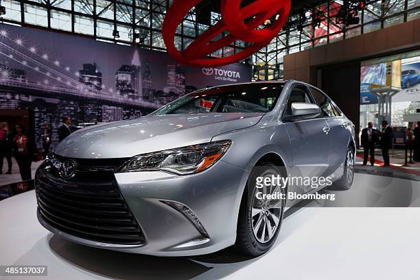 The new Toyota Motor Corp. 2015 Camry is displayed after the unveiling at the 2014 New York Auto Show in New York, U.S., on Wednesday, April 16,...
