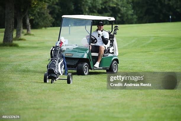 Stefan Kretzschmar rests in a golf buggy during the 'RTL - Wir helfen Kindern' Golf Charity 2015 tournament at Golf Club Oberberg on August 24, 2015...