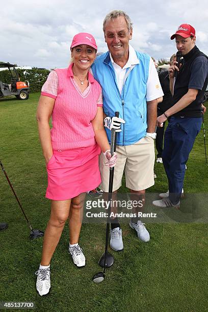 Heike Wontorra and Joerg Wontorra pose for a photograph during the 'RTL - Wir helfen Kindern' Golf Charity 2015 tournament at Golf Club Oberberg on...