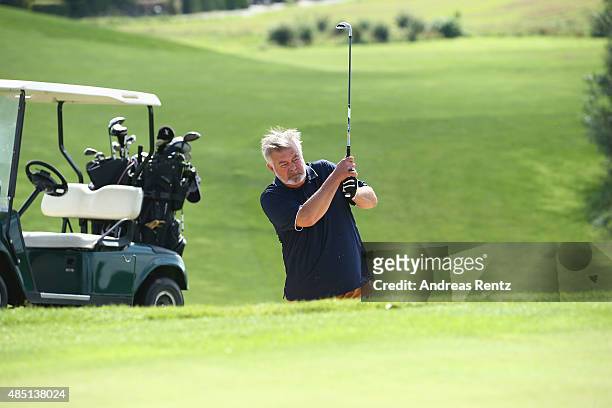 Harry Wijnvoord chips out of a bunke during the 'RTL - Wir helfen Kindern' Golf Charity 2015 tournament at Golf Club Oberberg on August 24, 2015 in...