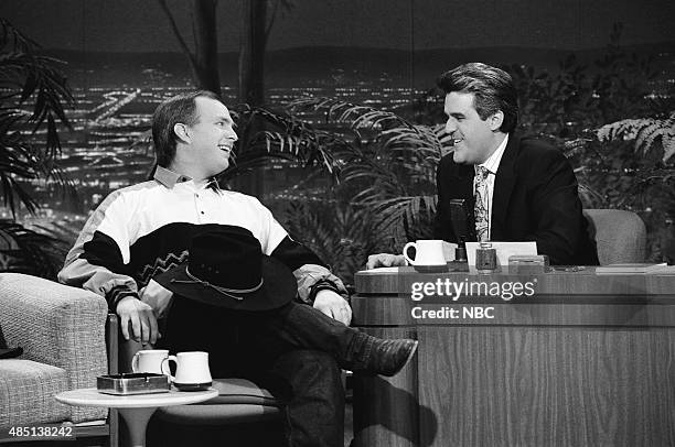 Pictured: Musical guest Garth Brooks during an interview with guest host Jay Leno on January 24, 1991 --