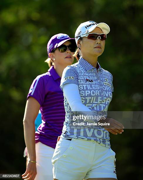 So Yeon Ryu of South Korea walks off the tee ahead of Paula Creamer on the 5th hole during the first round of the LPGA LOTTE Championship Presented...