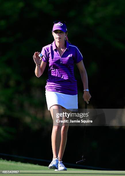 Paula Creamer of the USA waves to the crowd after sinking a putt on the 2nd hole during the first round of the LPGA LOTTE Championship Presented by J...