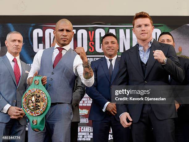 Current WBC champion Miguel Cotto and contender Canelo Alvarez pose during a news conference with Michael Yorkman , President & Chief of Branding and...