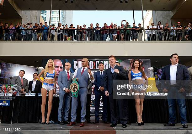 Current WBC champion Miguel Cotto and contender Canelo Alvarez pose after a news conference to announce their upcoming bout on August 24 in Los...