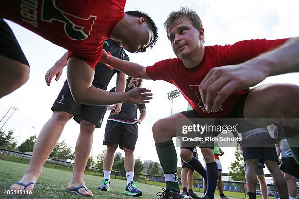 Adam Jones of Harlequins watches as rugby players from the University of Pennsylvania train with Harlequins on August 24, 2015 in Philadelphia,...