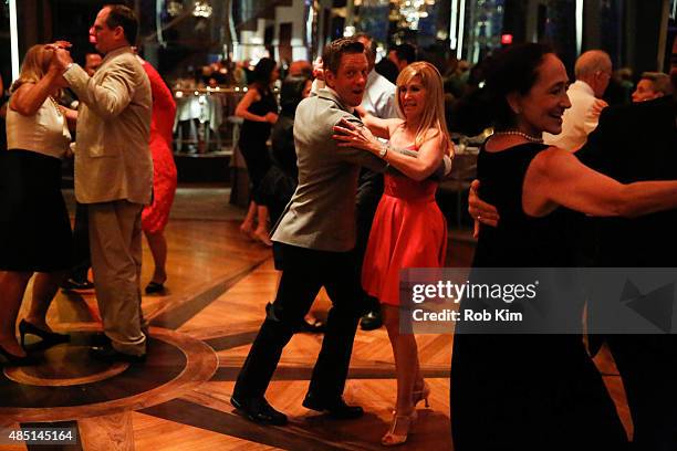 Patrons dance on the dance floor during Mondays With Max: Max Weinberg's Rainbow Room Residency at The Rainbow Room on August 24, 2015 in New York...