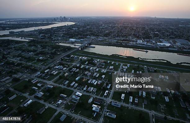 New homes are mixed with old homes and vacant lots in the Lower Ninth Ward in front of the Industrial Canal and downtown New Orleans on August 24,...