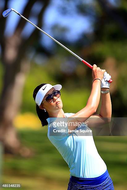 Michelle Wie hits her second shot on the 18th hole during the first round of the LPGA LOTTE Championship Presented by J Golf on April 16, 2014 in...