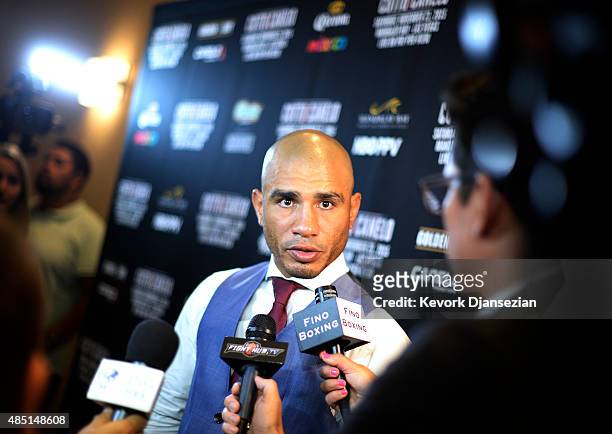 Current WBC champion Miguel Cotto speaks to reporters during a news conference to announce his next bout against Canelo Alvarez, former WBC and WBA...
