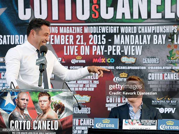 Oscar De La Hoya, Chairman and CEO, Golden Boy Promotions, reacts during a news conference with contender Canelo Alvarez , former WBC and WBA Super...