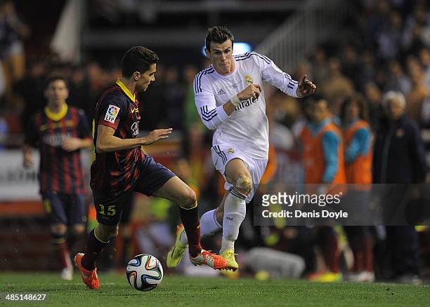 Gareth Bale of Real Madrid beats Marc Bartra of Barcelona during the Copa del Rey Final between Real Madrid and Barcelona at Estadio Mestalla on...