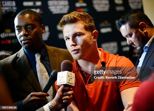 Boxer Canelo Alvarez, former WBC and WBA Super Welterweight World Champion, speaks to reporters during a news conference to announce his next bout...