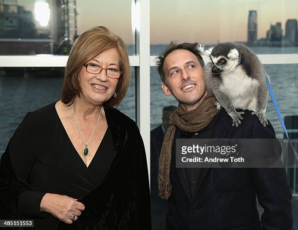 Honoree Dr. Patricia C. Wright and producer Drew Fellman pose for a photo with a lemur from Madagascar at the Stars of Stony Brook Gala 2014 at...