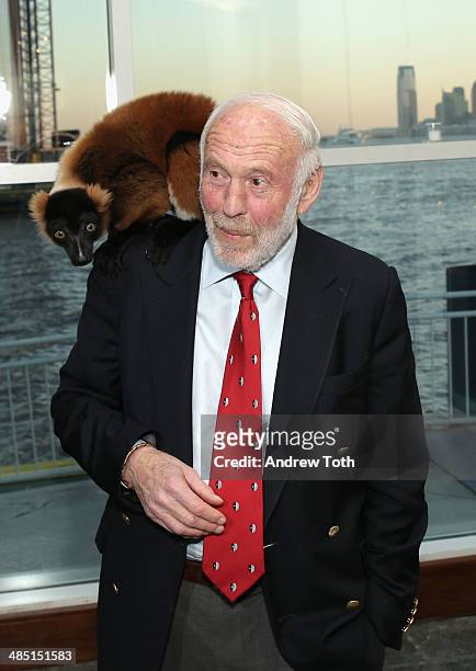 Philanthropist Jim Simons poses for a photo with a lemur from Madagascar at the Stars of Stony Brook Gala 2014 at Chelsea Piers on April 16, 2014 in...