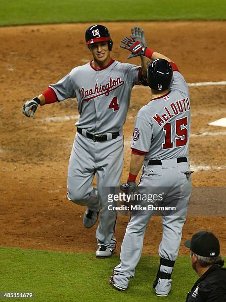 Zach Walters of the Washington Nationals is congratulated by Nate McLouth of the Washington Nationals after hitting a home run during a game against...