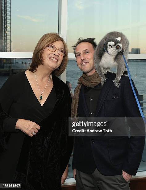 Honoree Dr. Patricia C. Wright and producer Drew Fellman pose for a photo with a lemur from Madagascar at the Stars of Stony Brook Gala 2014 at...