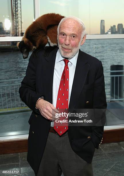 Philanthropist Jim Simons poses for a photo with a lemur from Madagascar at the Stars of Stony Brook Gala 2014 at Chelsea Piers on April 16, 2014 in...