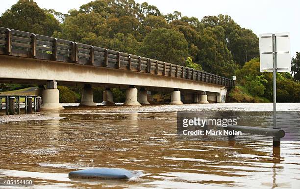 Flodded Minumurra River passes under bridges on August 25, 2015 in Minumurra, Australia. Residents downstreamm of the Jerra dam which feeds into the...