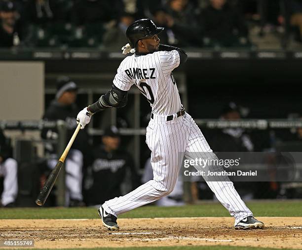 Alexei Ramirez of the Chicago White Sox hits a two-run home run in the 6th inning against the Boston Red Sox at U.S. Cellular Field on April 16, 2014...