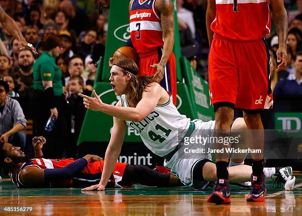 Kelly Olynyk of the Boston Celtics reacts after being called for a foul in front of John Wall of the Washington Wizards in the second half during the...