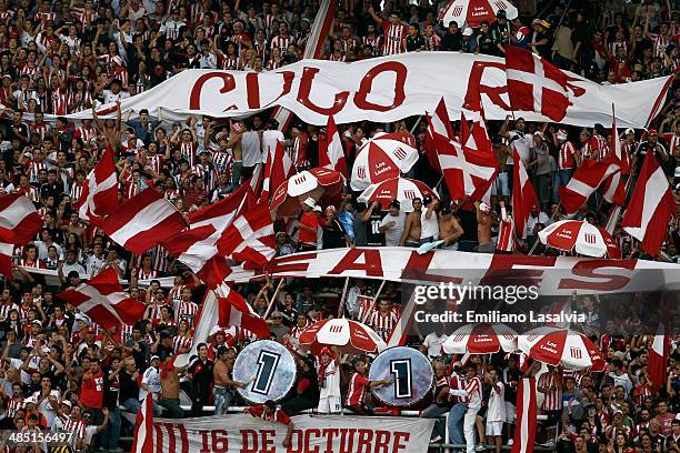 Supporters of Estudiantes cheer for their team during a match between Estudiantes and River Plate as part of 14th round of Torneo Final 2014 at...