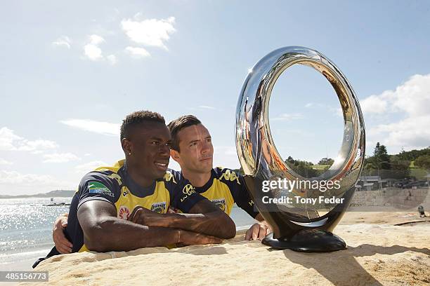 Bernie Ibini and John Hutchinson of the Central Coast Mariners poses with the A-League Finals Series Trophy at The Haven on April 17, 2014 in...