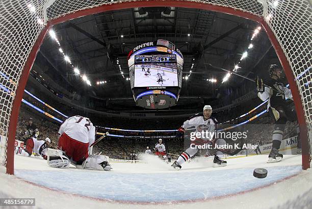 Brandon Sutter of the Pittsburgh Penguins scores past Sergei Bobrovsky of the Columbus Blue Jackets in the third period in Game One of the First...