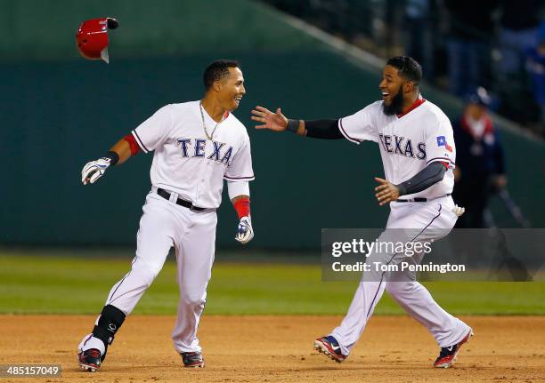 Leonys Martin of the Texas Rangers celebrates with Elvis Andrus of the Texas Rangers after Martin hit a walk off RBI single in the bottom of the...