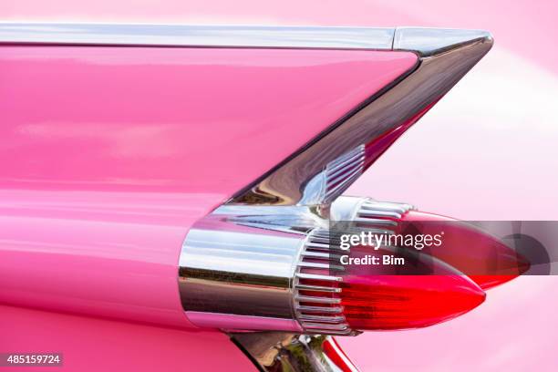 tail fin of 1959 pink cadillac de ville classic car - cadillac stock pictures, royalty-free photos & images