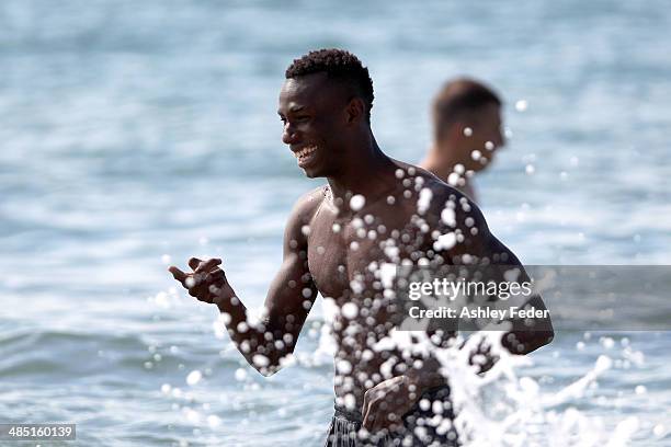 Bernie Ibini splashes in the ocean during a Central Coast Mariners recovery session at Terrigal Beach on April 17, 2014 in Terrigal, Australia.