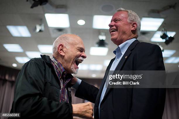 Republican candidate for U.S. Senate Rep. Paul Broun, R-Ga., right, speaks with supporter Jim Serrate, of Acworth, Ga., at the conclusion of the Cobb...