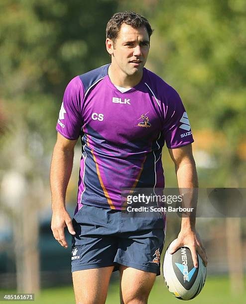 Cameron Smith of the Storm runs with the ball during a Melbourne Storm NRL training session at Gosch's Paddock on April 17, 2014 in Melbourne,...