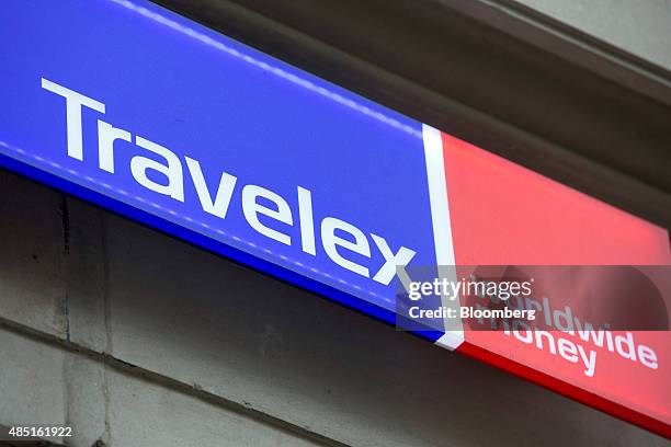 Sign sits outside a Travelex UK Ltd. Currency exchange in London, U.K., on Monday, Aug. 24, 2015. European stocks rallied with U.S. Equity-index...