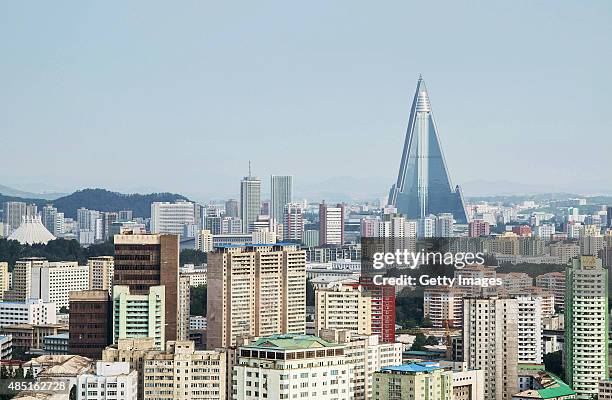 View of the Pyongyang cityscape, looking towards the Ryugyong Hotel Tower from Yanggakdo Hotel on August 24, 2015 in Pyongyang, North Korea. North...