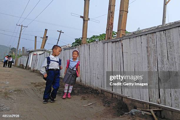 Kids go to school in the morning on August 20, 2015 in Tumangang, North Korea. North and South Korea today came to an agreement to ease tensions...